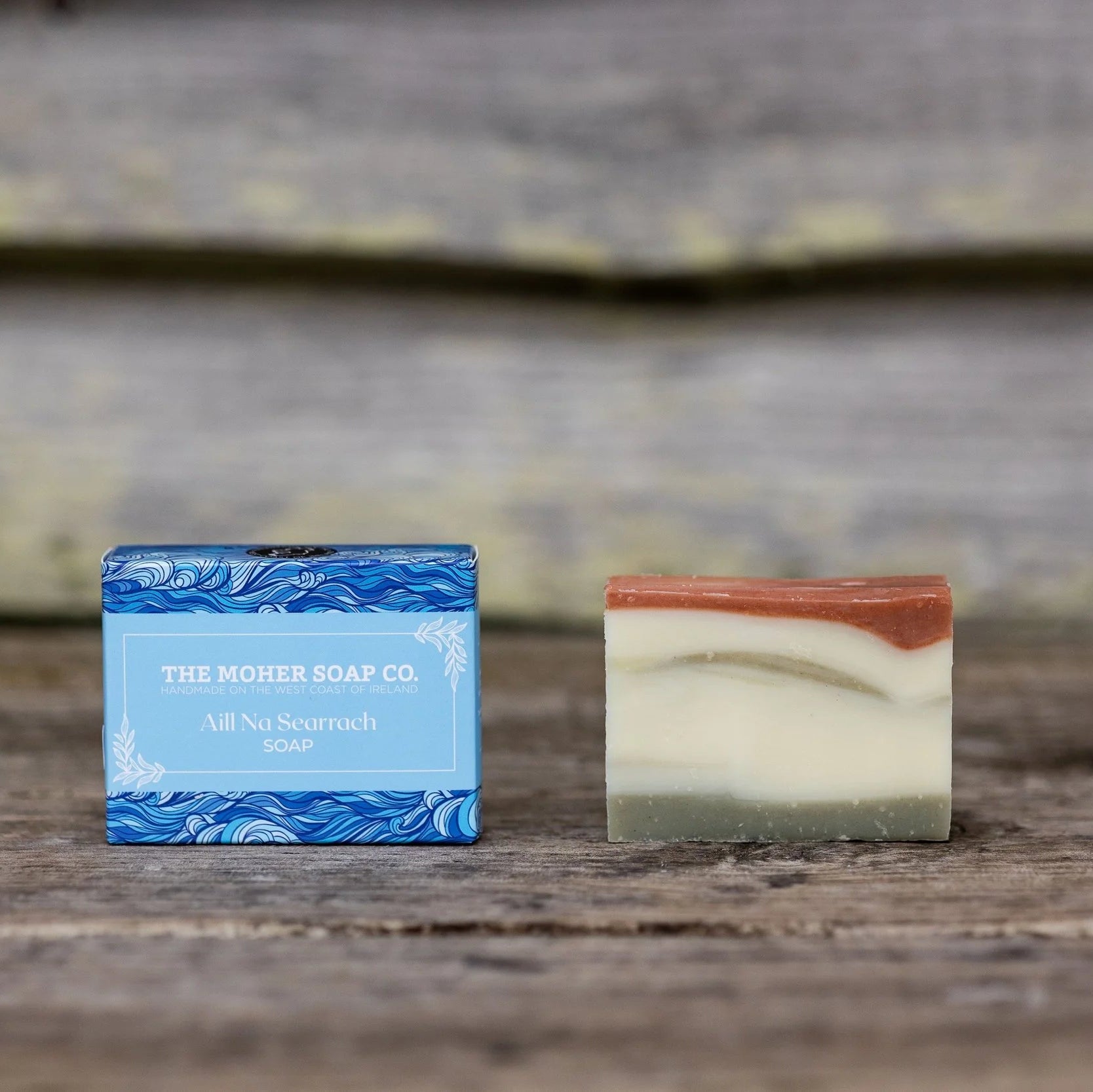 Two soap bars from The Moher Soap Co on a wooden surface