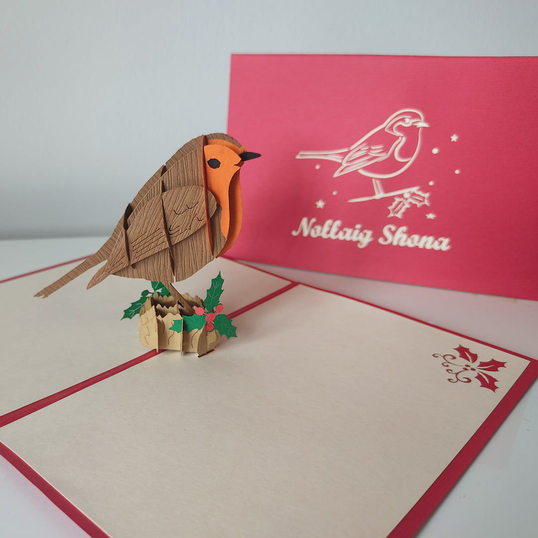 Pop-up card with a robin design and a red card in the background.