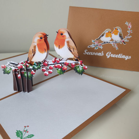 Pop-up card with birds on a branch and 'Season's Greetings' text