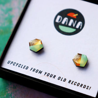 Dana brand earrings on a card with branding and text about upcycling from old records.